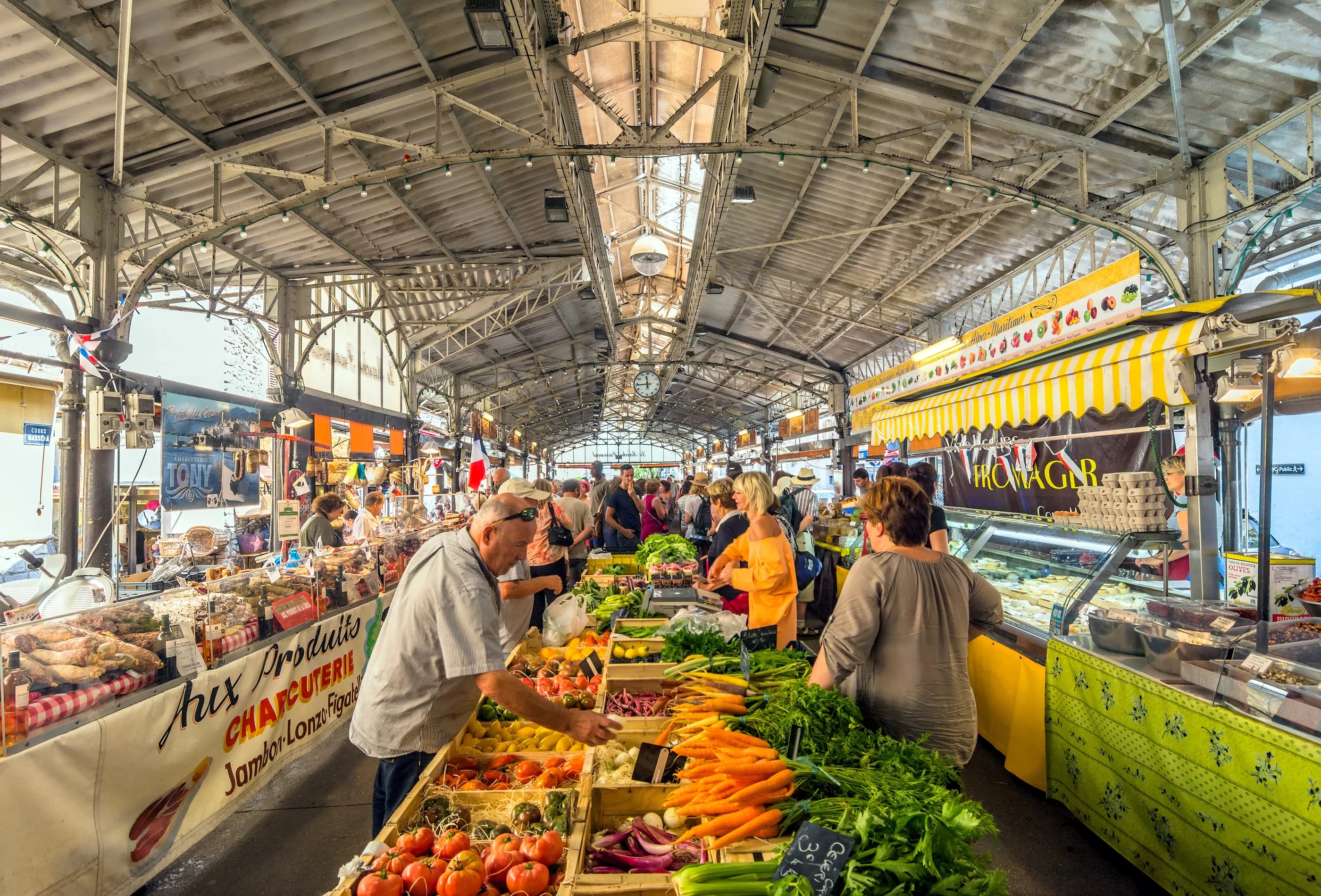 Fruit, vegetable and flower stalls under the iron canopy of the Marché Provençal on the Cours Masséna