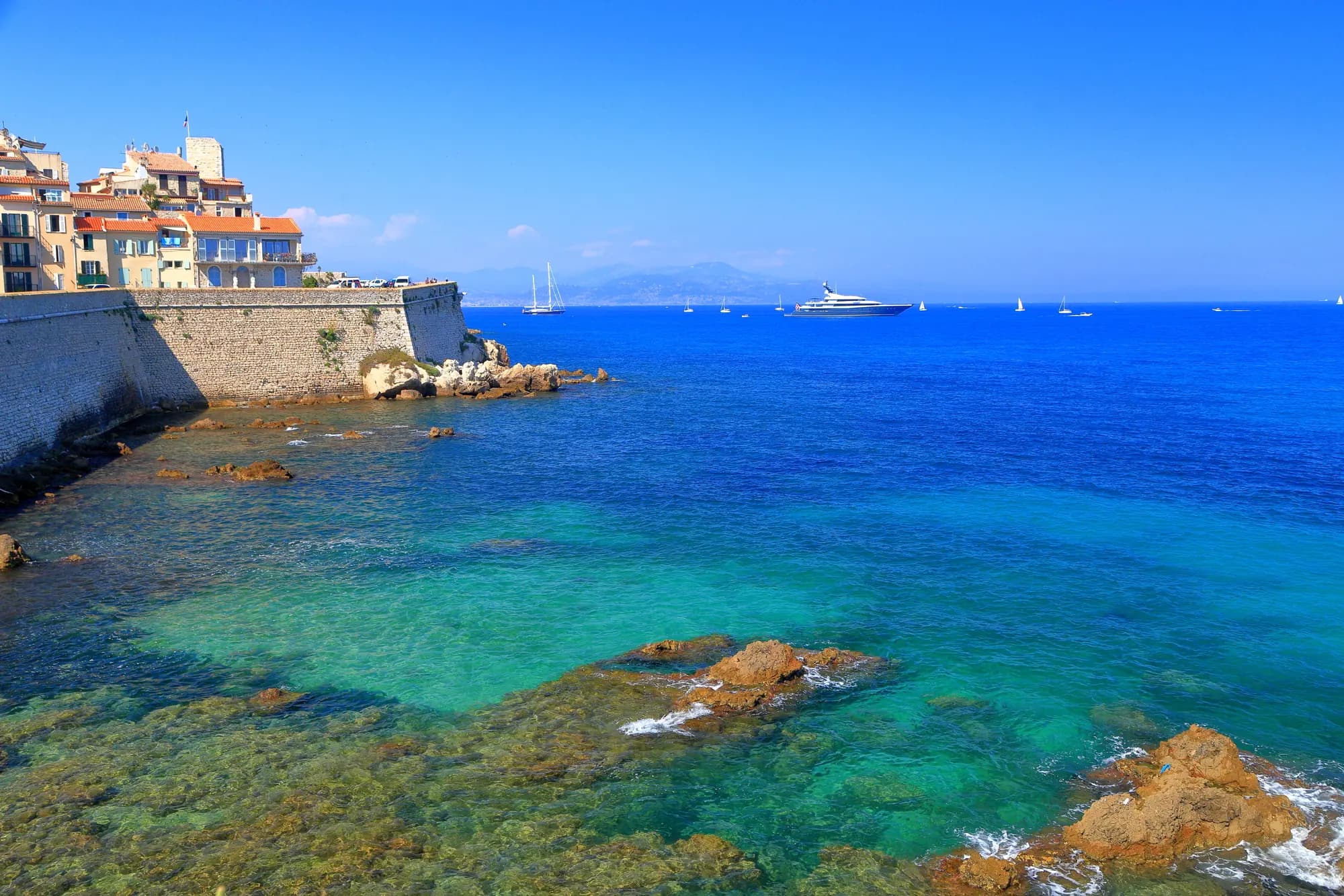 The ramparts of old Antibes above the turquoise Mediterranean
