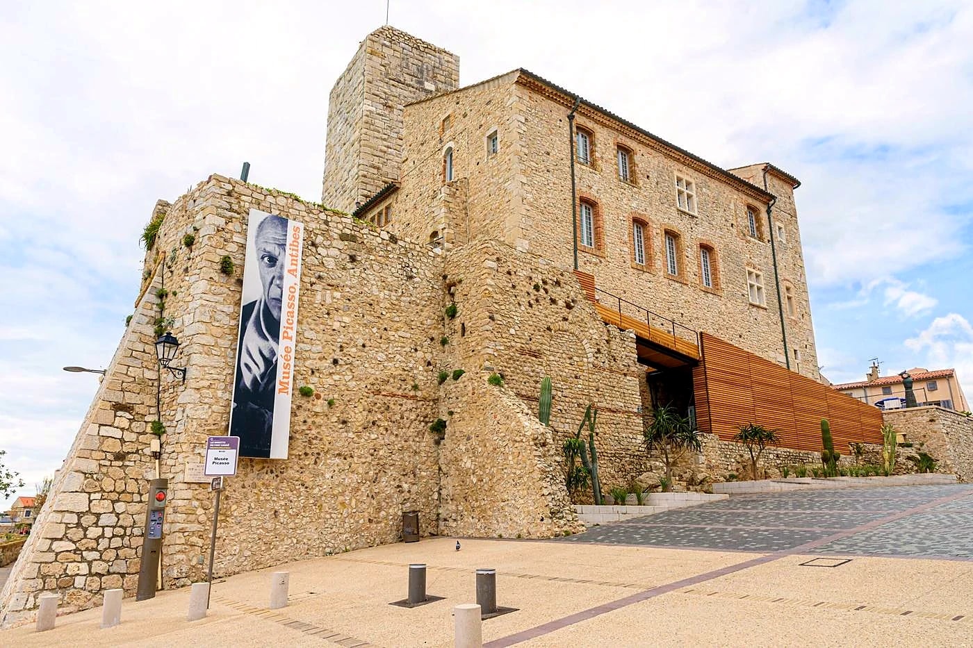 The Château Grimaldi in Antibes, home of the Musée Picasso, its banner hung on the rampart wall