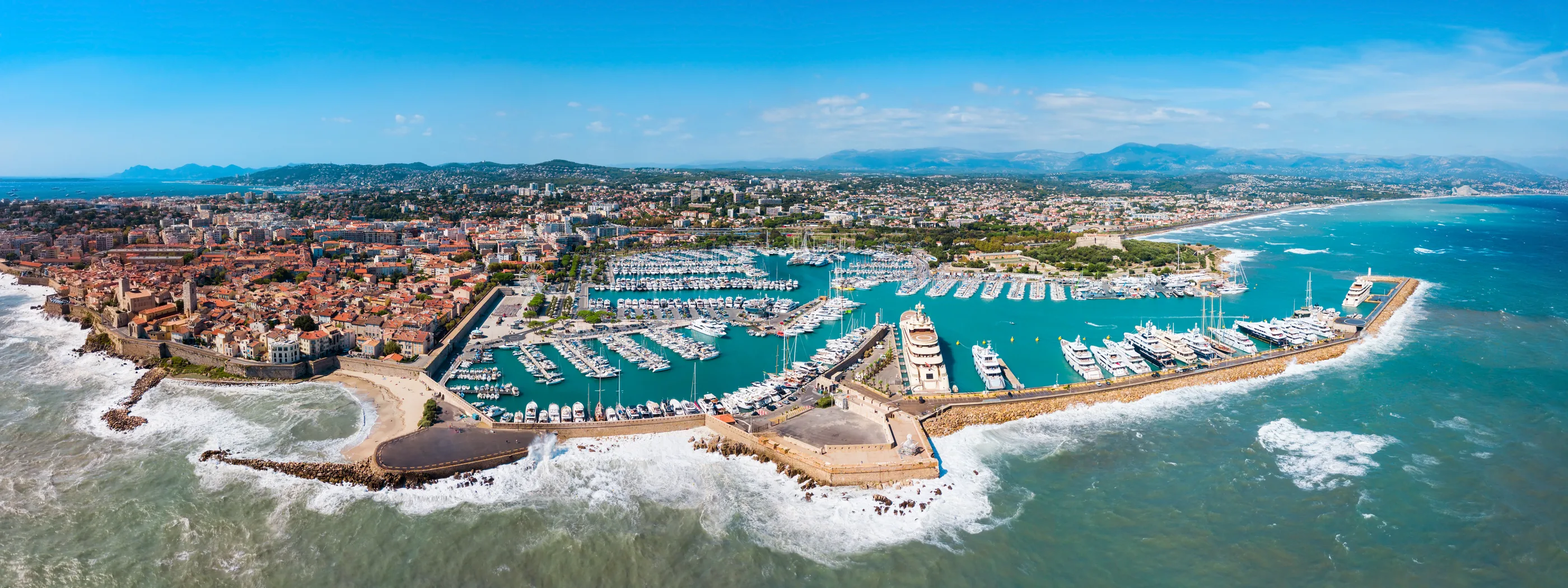 Panoramic aerial view of old Antibes — the ramparts, La Gravette beach, Port Vauban and the Fort Carré