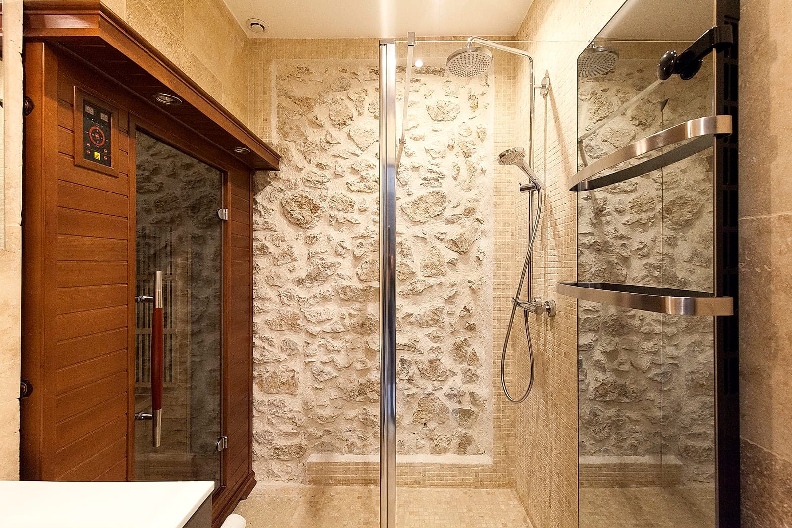Stone shower behind an old wooden door, Maison Baieta, old Antibes