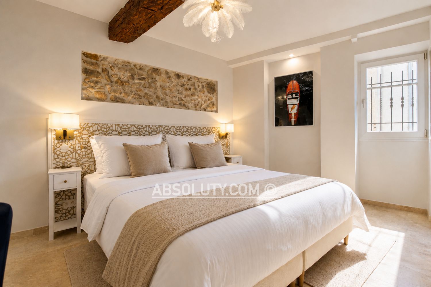 Maison SOLEIHA master bedroom with historic stone details